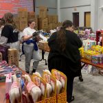Volunteers sort toys
