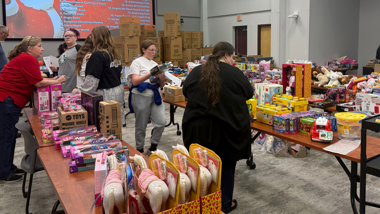 Volunteers sort toys
