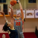 Mara Rieder shoots over a defender near the basket