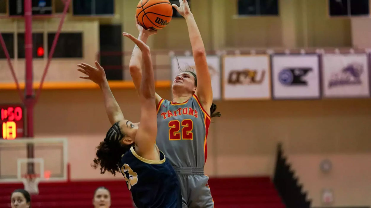 Mara Rieder shoots over a defender near the basket