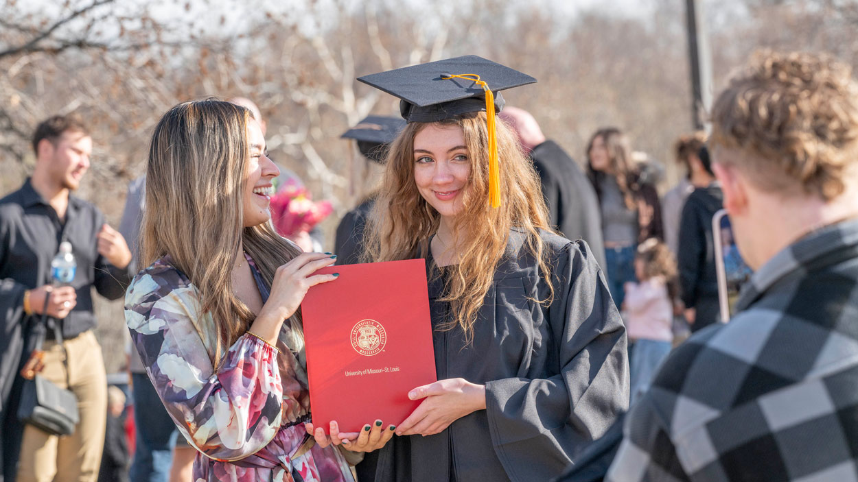 New graduates gathered with their family and friends outside the Mark Twain Athletic Center on Saturday