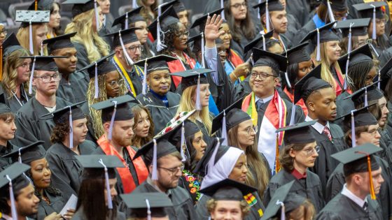 UMSL Bachelor of Science Data Science and Analysis, Sai Kaung Khant, waves to family and friends during commencement ceremony on Saturday December 20, 2025.