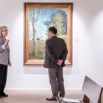 Julie Dunn-Morton gives Mun Y. Choi a tour of the Wallace H. Smith Gallery of Art