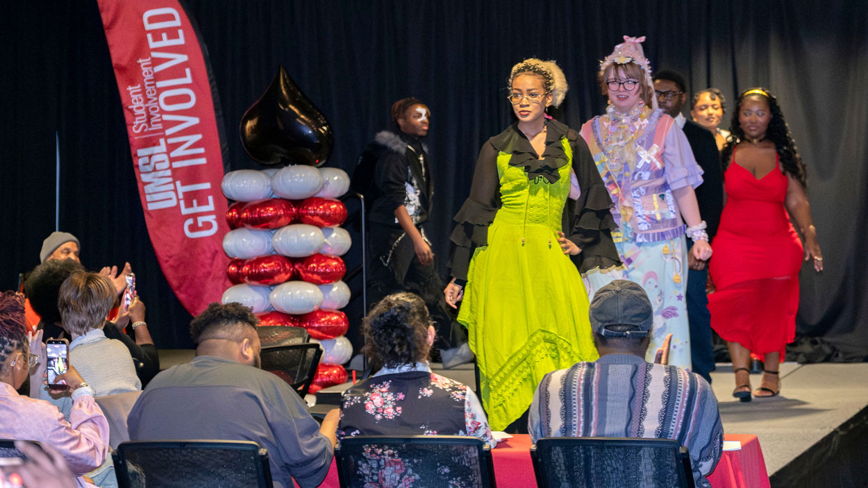 Students walk during fashion show