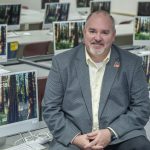 Chris Scheetz sitting in a computer lab
