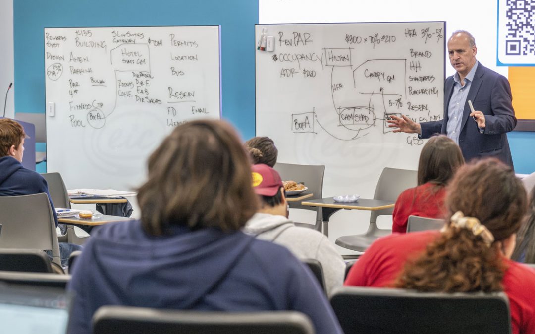 Guest lecturer Steven Shapiro gives UMSL entrepreneurship students a peek into the hotel industry