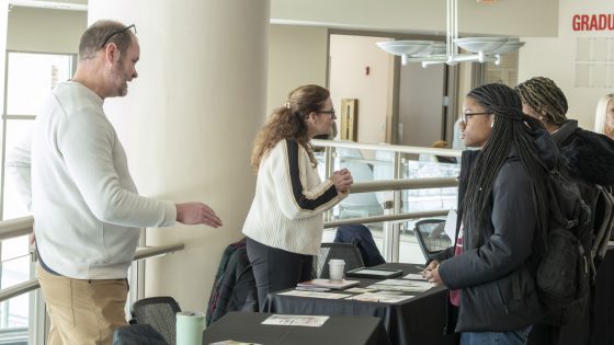 Freshman cybersecurity major Gemilla Kelly speaks to Associate Teaching Professor Tim Abeln during the annual Study Abroad Fair