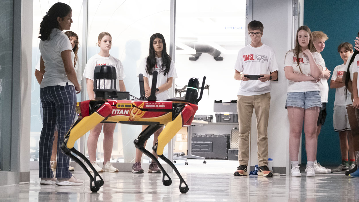 Area high school students take turns controlling Titan, UMSL's robotic dog, at the UMSL Geospatial Summer Camp in June 2025.