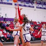 Morgan Ramthun shoots while being guarded by two McKendree defenders