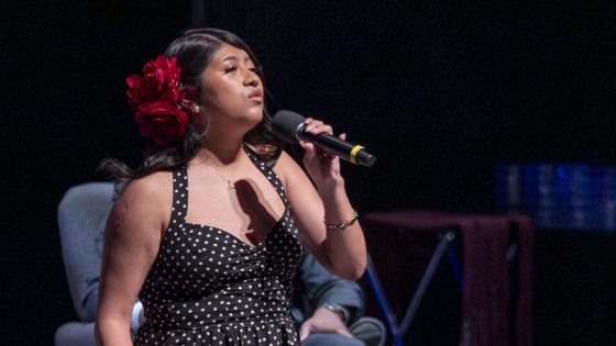 Sarai George-Mendieta signs during Saturday's UMSL Bridge Program Saturday Academy Award Recognition Ceremony