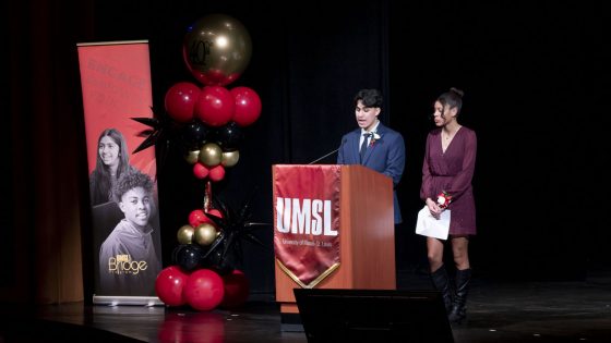 Jackson Paiz Rodriguez and Brooklyn Wilson stand at the lectern while serving as the master and mistress of ceremonies