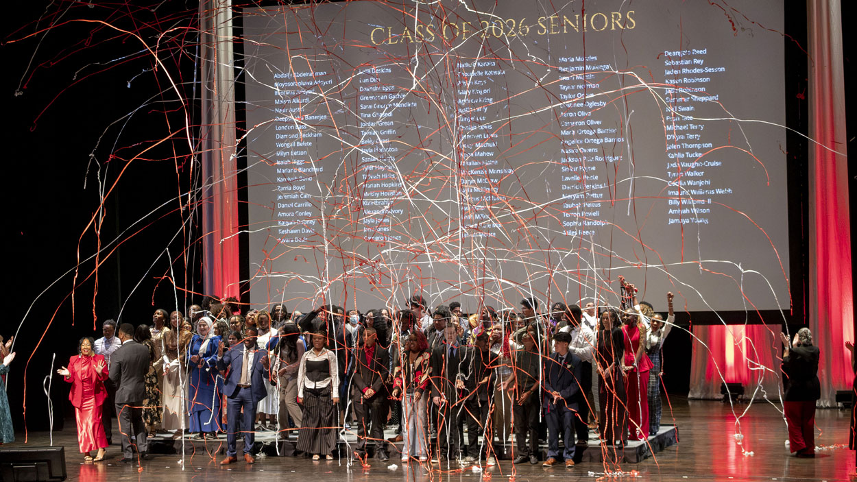 Streamers fall on members of the Bridge Program's 2026 senior class during the annual Saturday Academy Award Recognition Ceremony