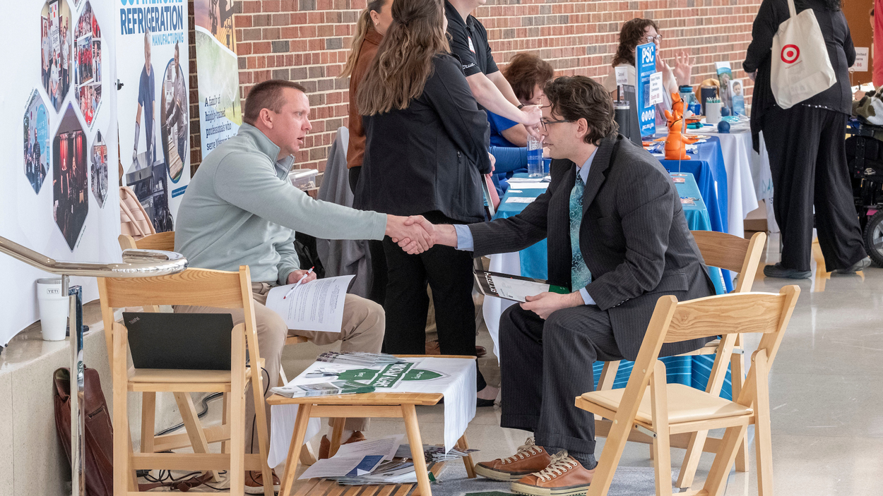 J.R. Maxfield, Assistant Vice President, Talent Acquisition with Safety National, speaks with UMSL junior computer major, Jeremy Ringkamp
