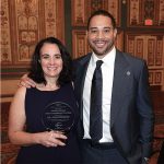 Julie DeKinder accepts award with Tommy Pham