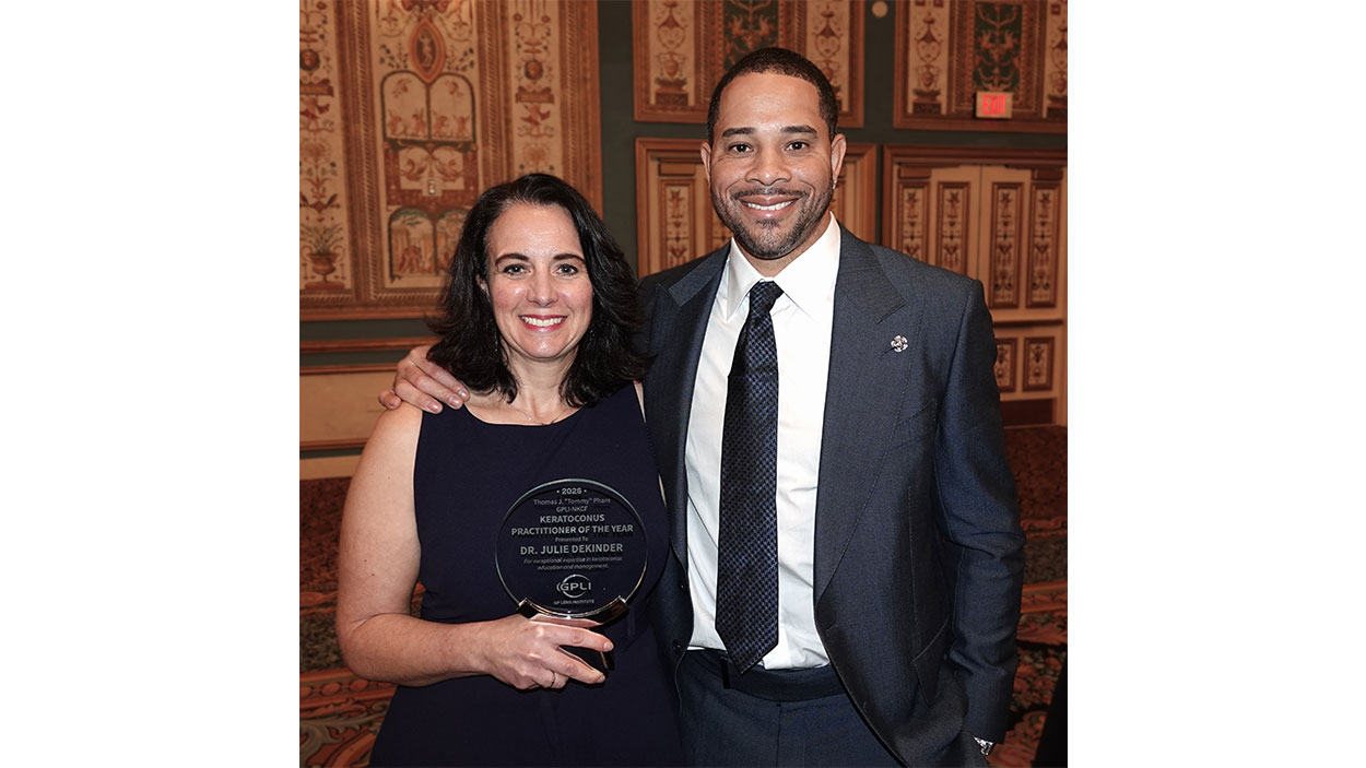 Julie DeKinder accepts award with Tommy Pham