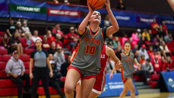 Jayden Kuper drives for a layup against Maryville