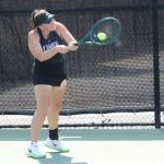 UMSL tennis player Morgan Lint hits a two-handed backhand