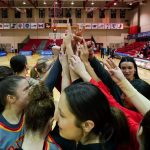Members of the UMSL women's basketball team huddle before a game in the Great Lakes Valley Conference Tournament