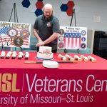 Michael Feger cuts cake