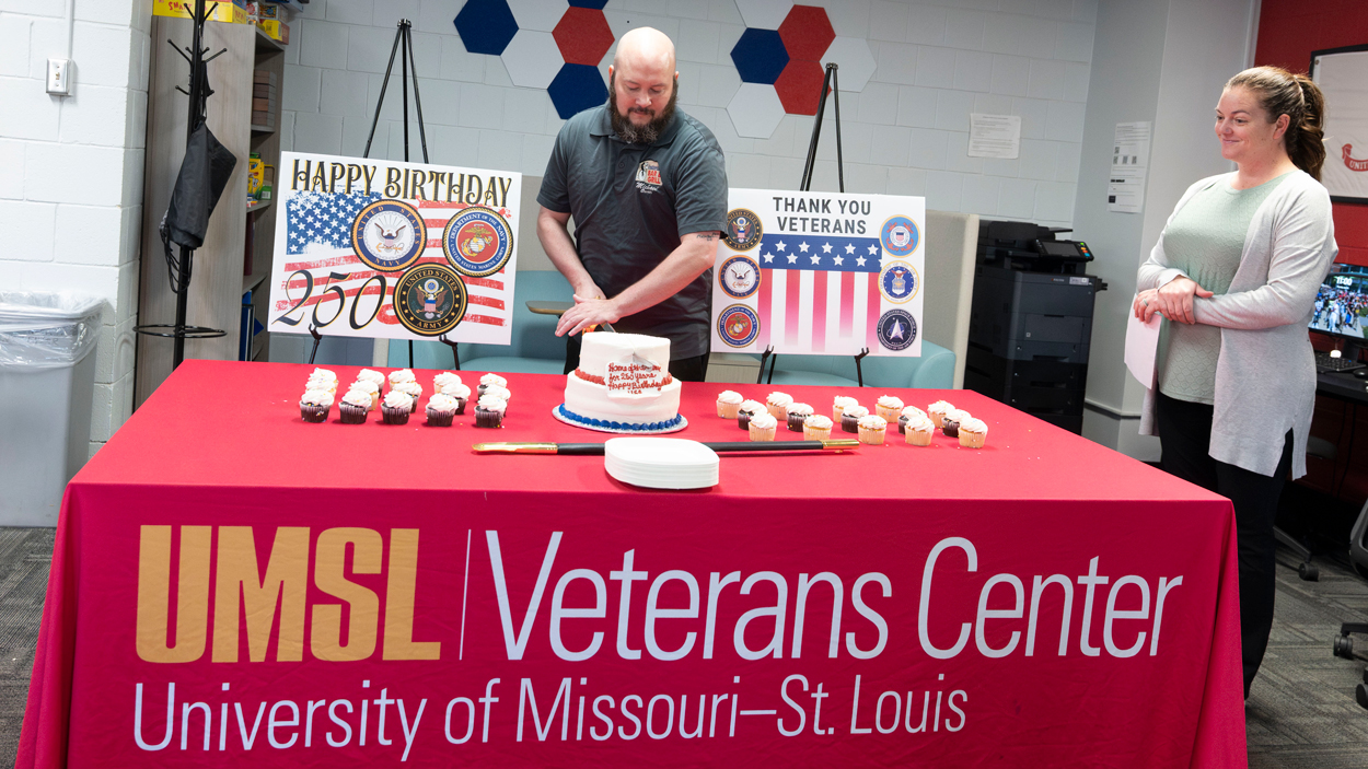 Michael Feger cuts cake