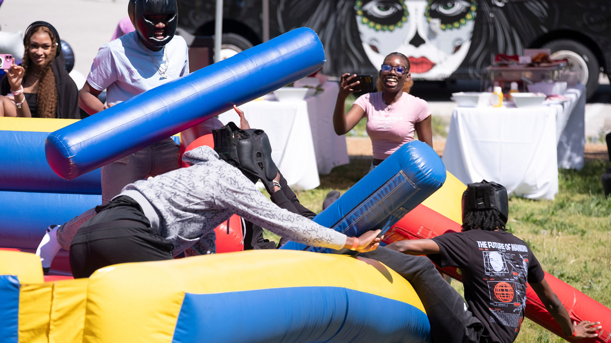 Students battle each other in gladiator duel. 