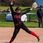 Softball player Ashley Ware winds up to deliver a pitch
