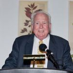 Peter Raven speaking at a lectern