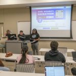 UMSL students work together as part of the planning committee for the UMSL Women's Hackathon in 2024