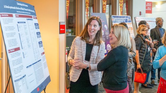 Renata Sledge, an assistant professor of social work, speaks with Senior Associate Director of Corporate and Foundation Relations Pamela Farrar