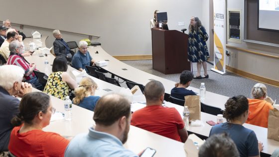 Students, faculty and staff members listen to Aimee Dunlap as she presents during the NextGen Precision Health Discovery Series event in the MSC