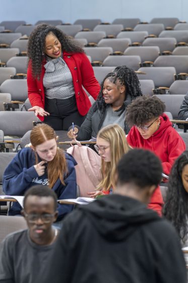 Channon Peoples talks to a student during a Saturday Academy session in early February.