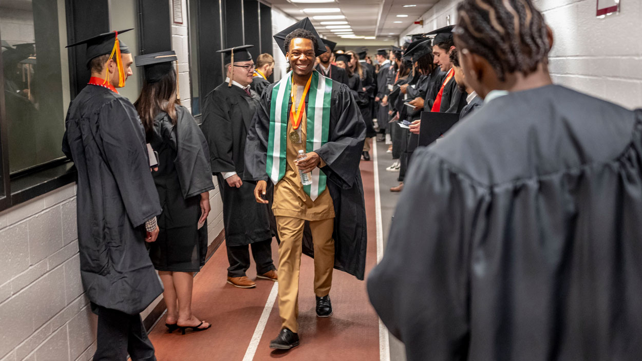 Students in the Ed G. Smith College of Business line up before the commencement ceremony held in the Mark Twain Athletic Center on May 15.