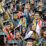 UMSL Bachelor of Science Data Science and Analysis student Sai Kaung Khant waves to family and friends during the fall 2025 commencement ceremony on Saturday December 20, 2025