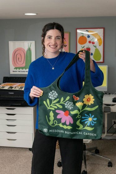 Ariel Biggerstaff with a tote she designed for the Missouri Botanical Garden