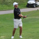 Sophomore Logan Mayo watches his ball after a short pitch shot