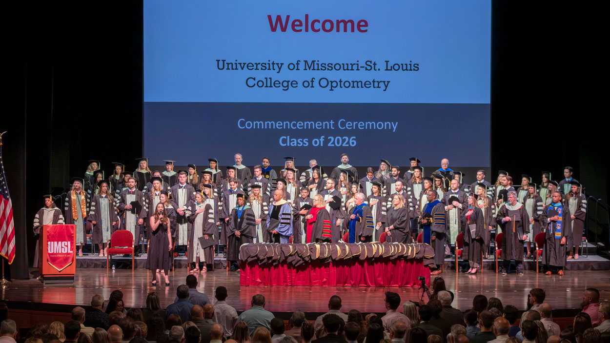 UMSL music student Mackenna Glazer sings the national anthem during the College of Optometry commencement ceremony held in the Touhill Performing Arts Center on May 15.