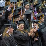 UMSL students celebrate during the conferral of academic degrees.