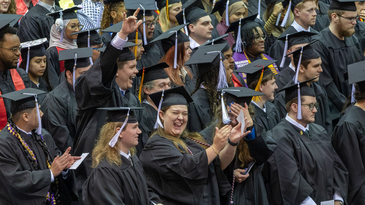 UMSL students celebrate during the conferral of academic degrees.