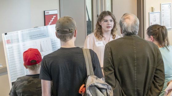 Allison Lendman gives a poster presentation of her research on blind cave fish during the Undergraduate Research Symposium in April