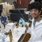 Ayush Vasireddy sits in the lab at in the William L. Clay Center for Nanoscience on the UMSL campus