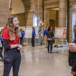 Biology major Zoe Ellis discusses her research on livebearing fish with Representative Marla Smith and Senator Brian Williams on March 12 at Undergraduate Research Day at the Missouri Capitol