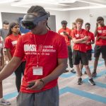 CBC High School student Ethan Williams wearing VR goggles at the UMSL Geospatial Summer Camp
