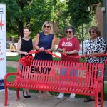 UMSL Chief of Staff Adella Jones cuts a ribbon to mark the installation of a new bus bench, courtesy of Citizens for Modern Transit's "The Story of a Bench" program. She is joined by Citizens for Modern Transit Board Chair Ellie Glenn Harmon, CMT CEO Kim Cella, St. Louis County Council Chair Rita Heard Days and Metro Transit COO Ronald Forrest
