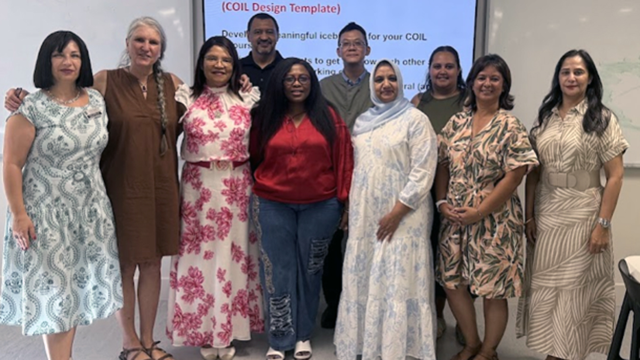 Alina Slapac and Karen Collett with UWC faculty during COIL workshop 