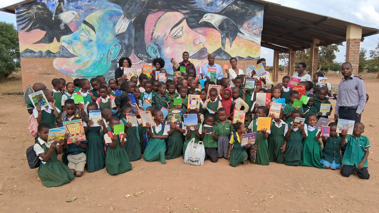 Tchule Moore with students in Malawi