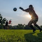 Goalkeeper Hannah McFarlane prepares to stop a shot during the women's soccer team's early morning workout last Tuesday