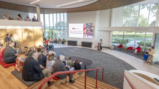 Alumni and donors gather in the Terry and Stan Freerks Forum during a dedication ceremony for the new Richter Family Welcome and Alumni Center
