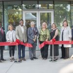 Interim Chancellor Chris Spilling cuts a ribbon as UMSL dedicates the new Richter Family Welcome and Alumni Center