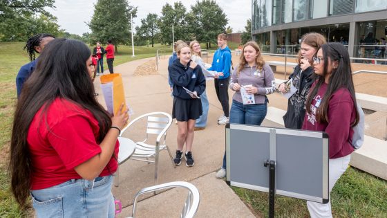 At left, freshman International Relations major, Sara Hernandez, asks trivia questions to Troy Buchanan high school students, Payton Baugh, Elsie Smith, Lorelei Westhoff and Cailyn Zorilla.