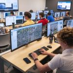 Students use mapping software during a geospatial workshop at UMSL